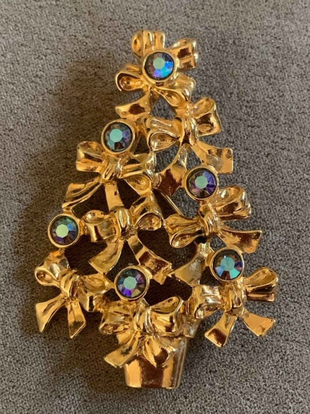 Avon Christmas tree brooch accented with blue aurora borealis